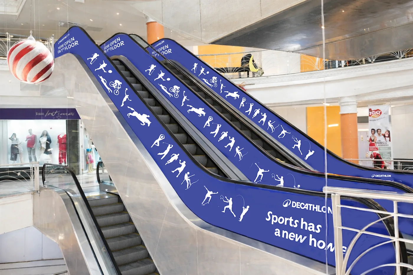 Decathlon escalator branding in a shopping mall