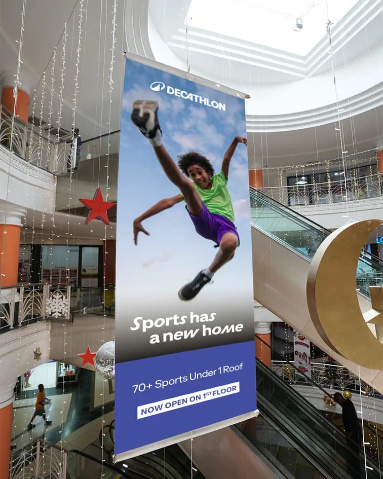 Hanging mall banners announcing the new store